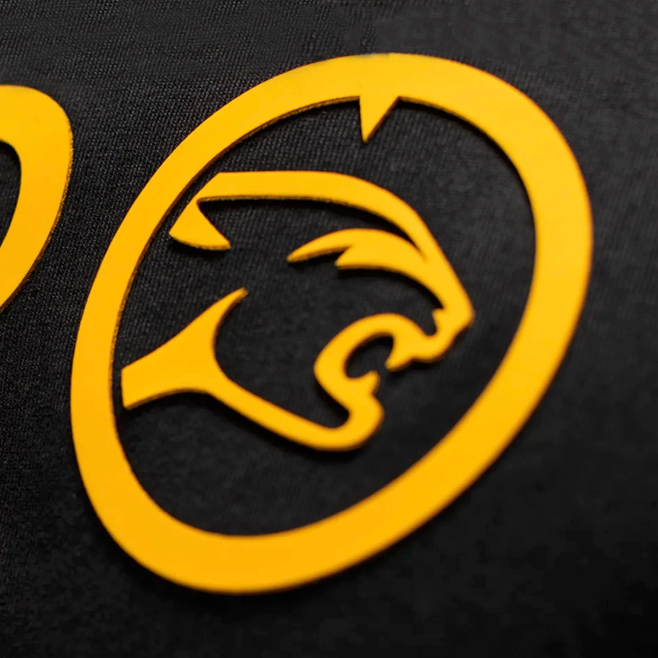 Yellow logo of a cat head on a black background.