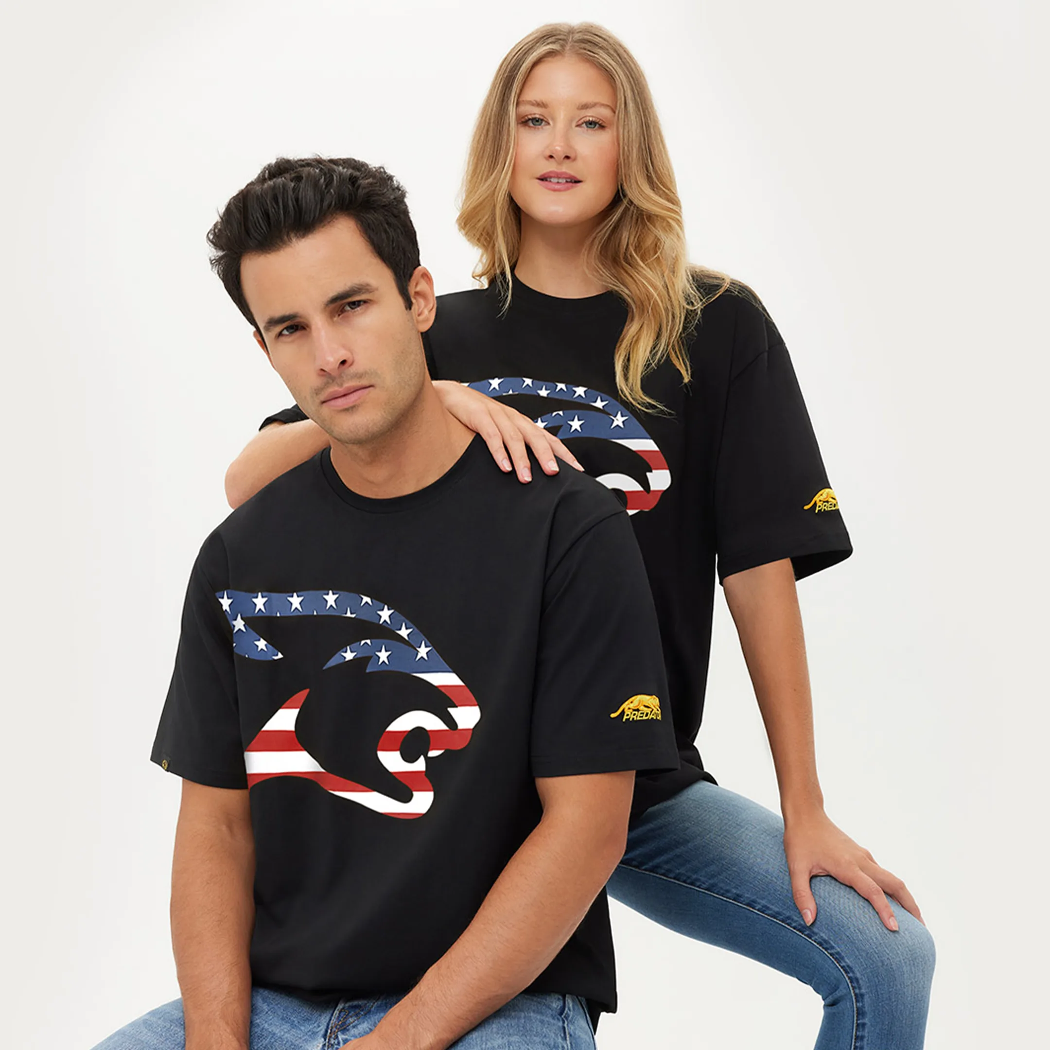 People wearing black t-shirts with a United States flag cat head design