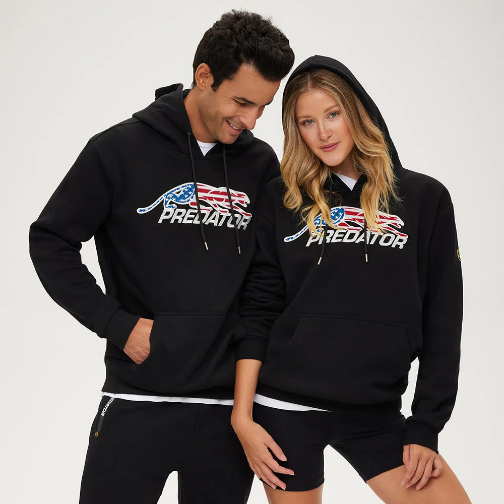 Two people wearing black 'Predator' hoodies with an American flag design