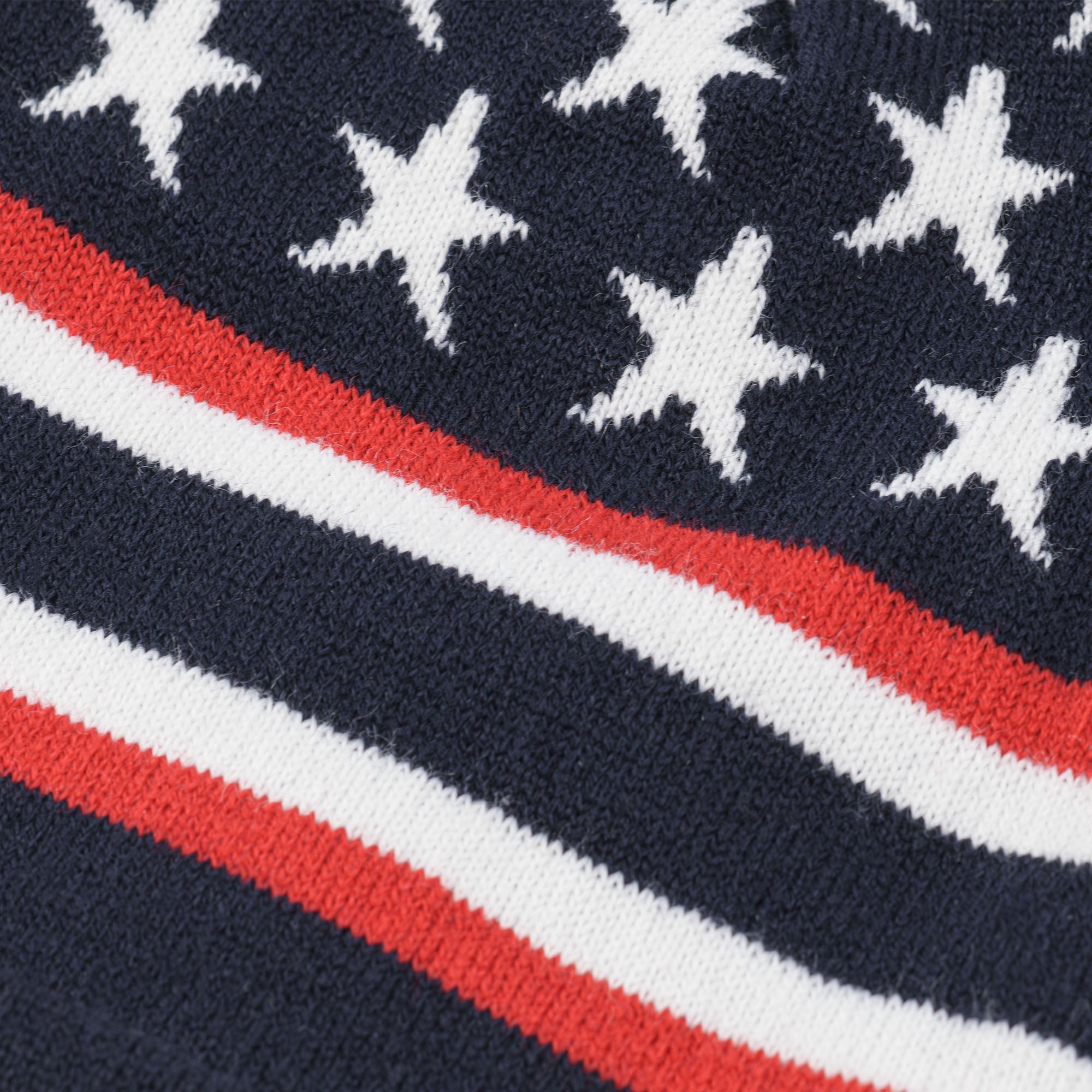 Close-up of red, white, and blue beanie with stars and stripes.