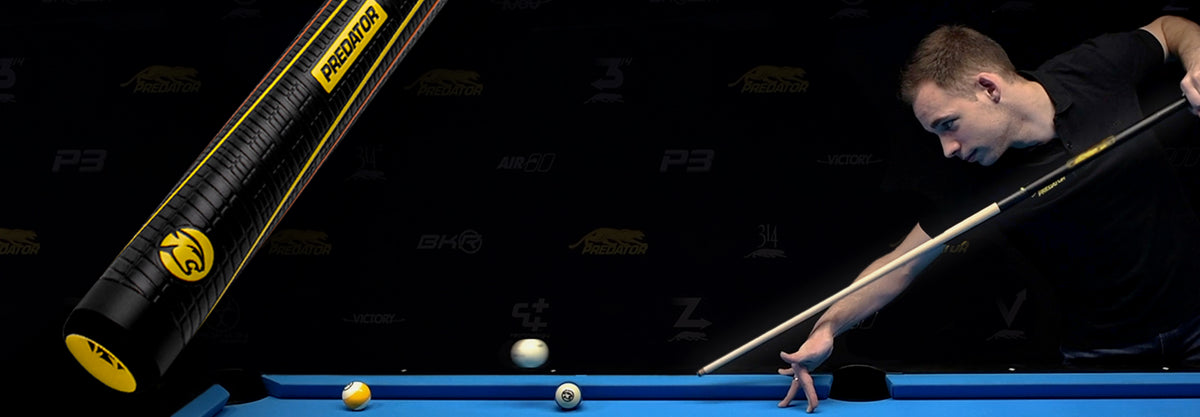 Man playing pool with a cue and balls on a pool table