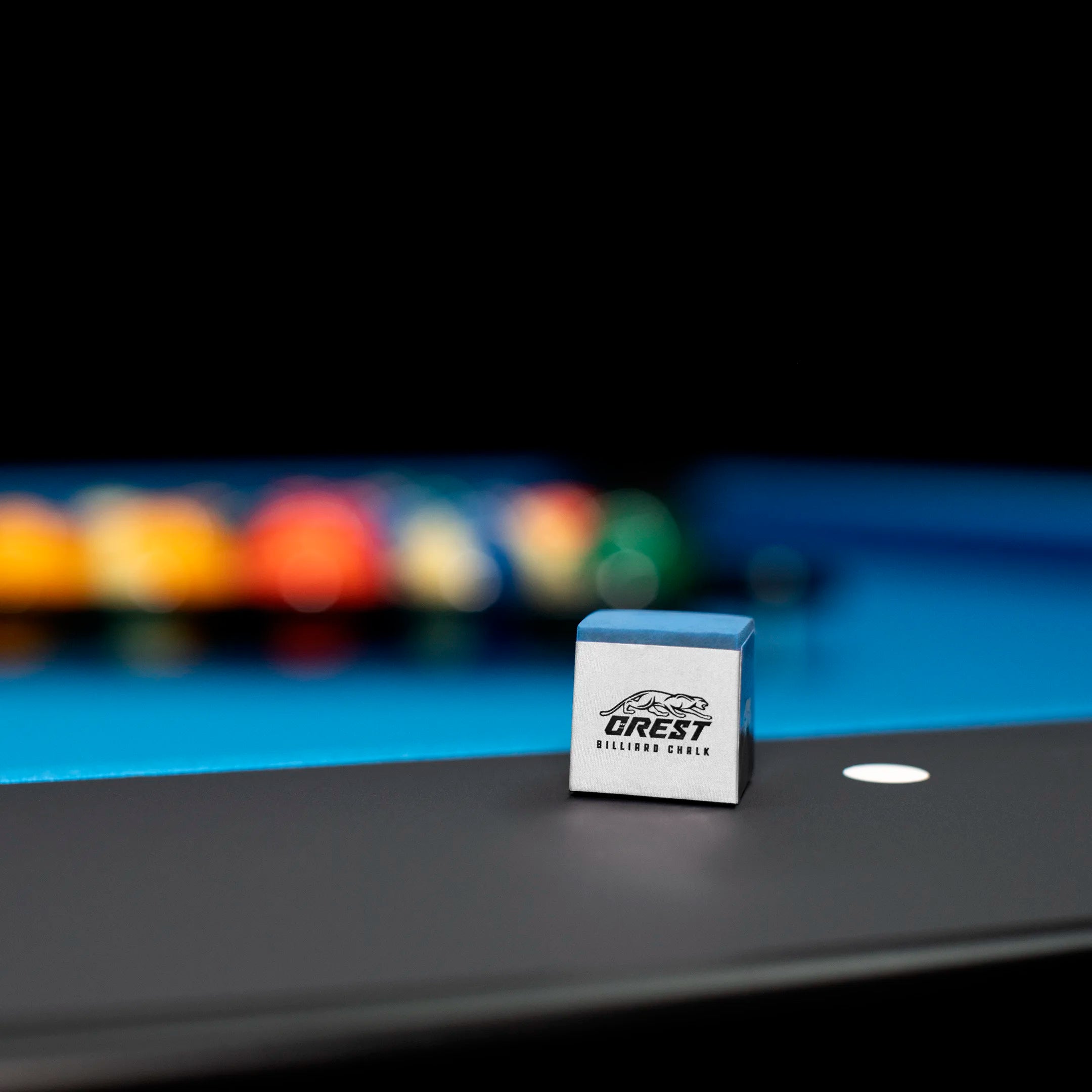 Crest billiard chalk on a table 
