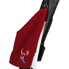 Red towel with red, white, and blue cat head logo, clipped to black and white pool cue case.