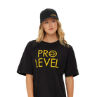Woman wearing a black 'PRO LEVEL' t-shirt and cap