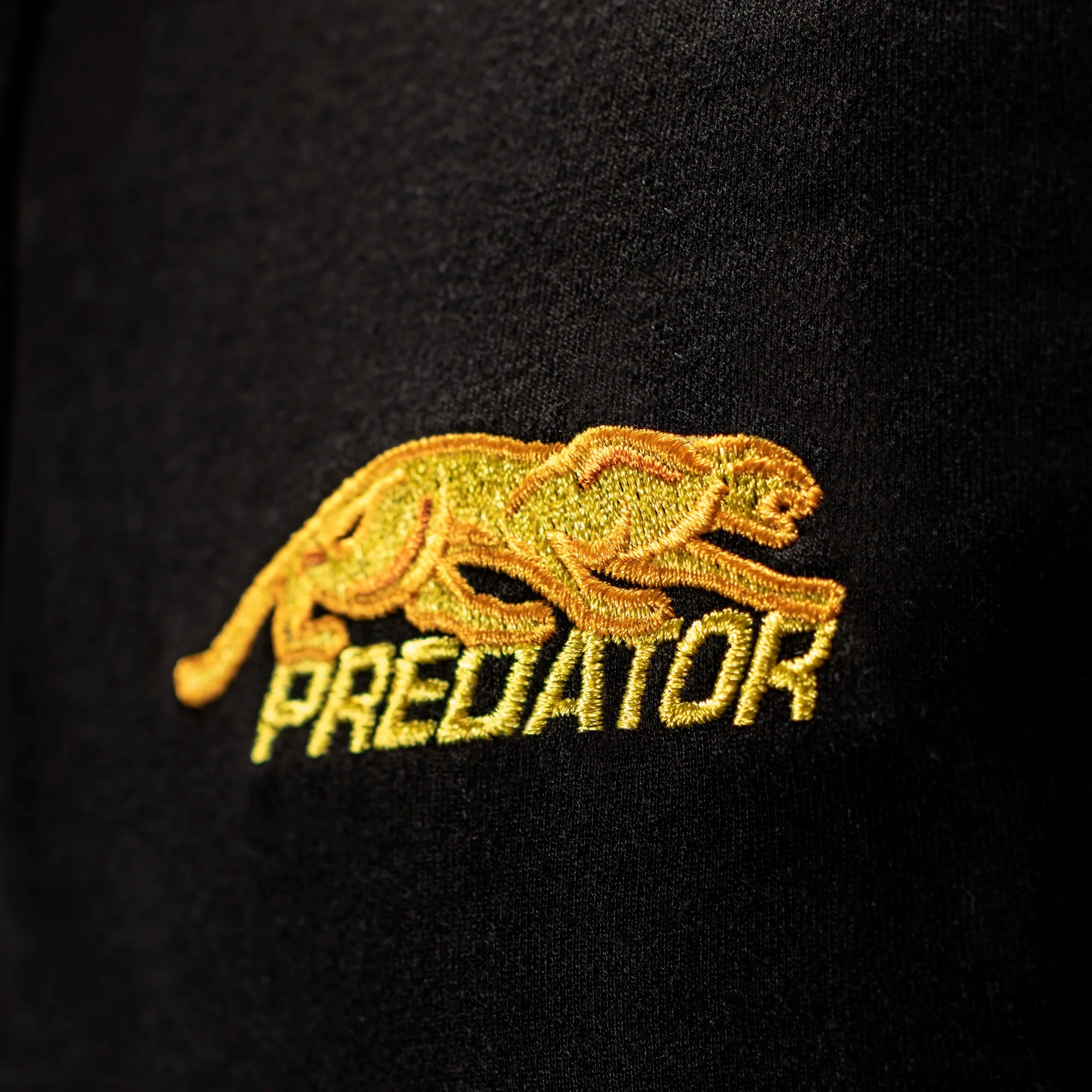 Gold embroidered PREDATOR  logo