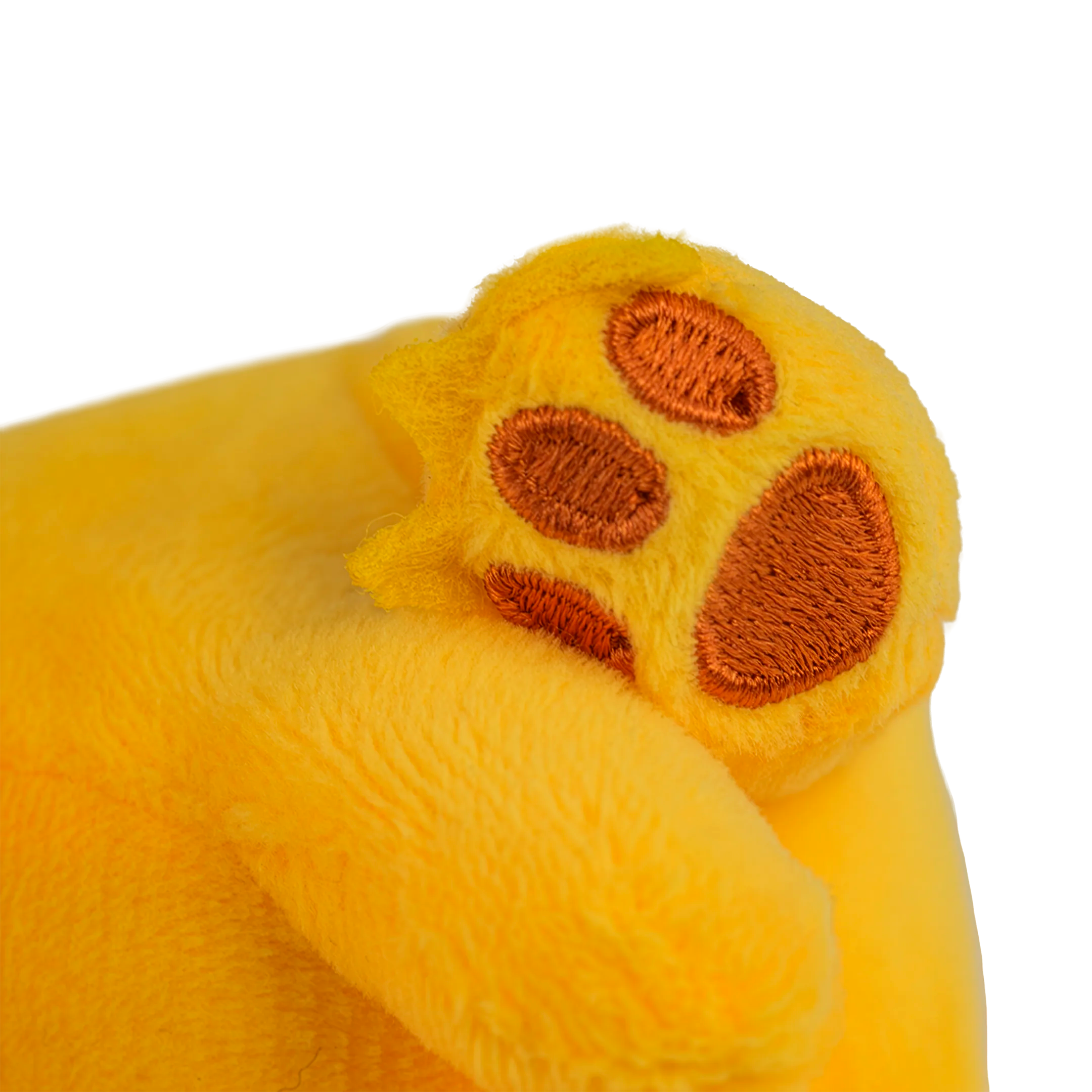 Close-up of a yellow plush toy paw with brown pads on a white background.