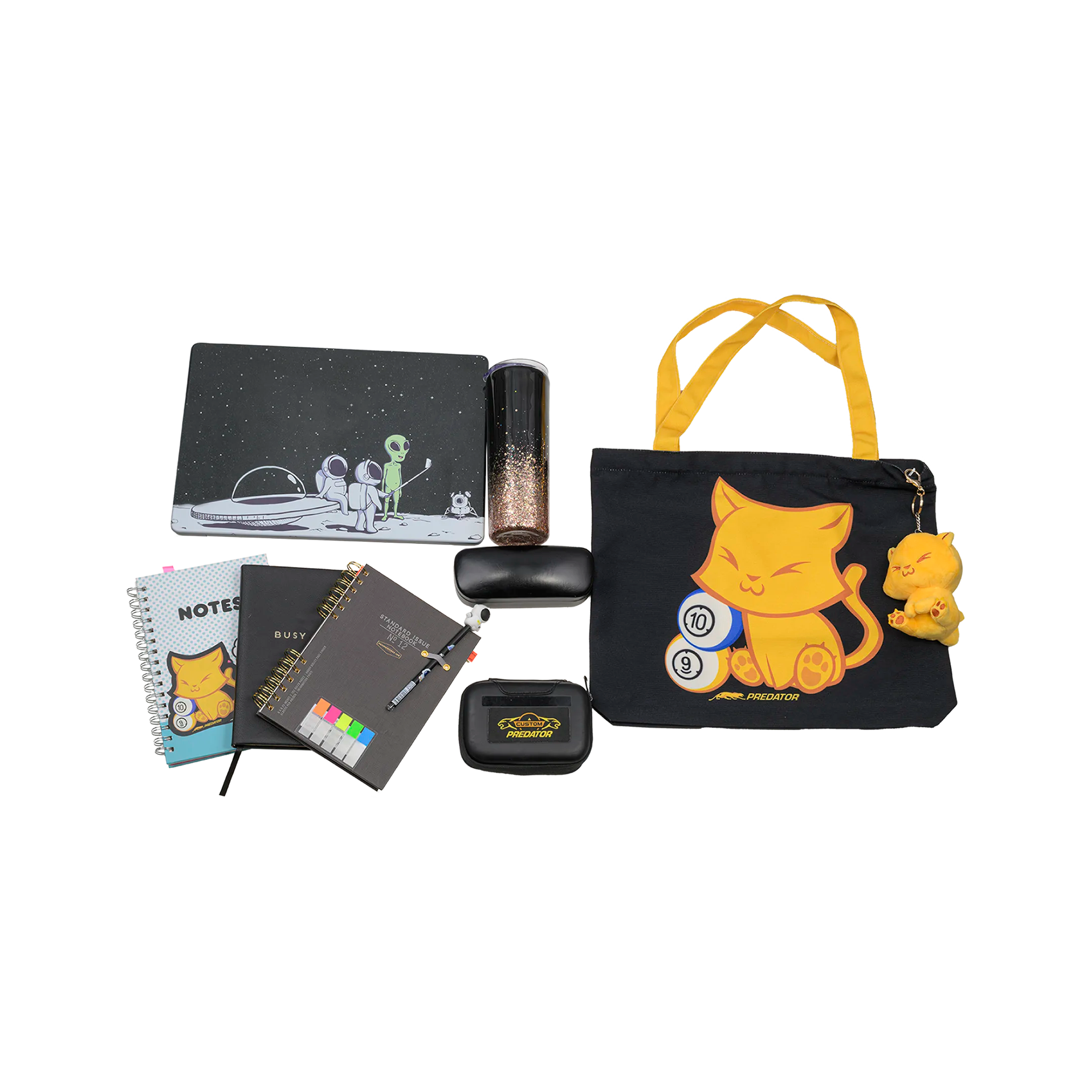 Collection of stationery items including notebooks, a pencil case, and a tote bag with cat designs on a white background.