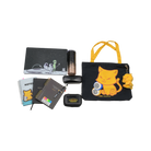 Collection of stationery items including notebooks, a pencil case, and a tote bag with cat designs on a white background.