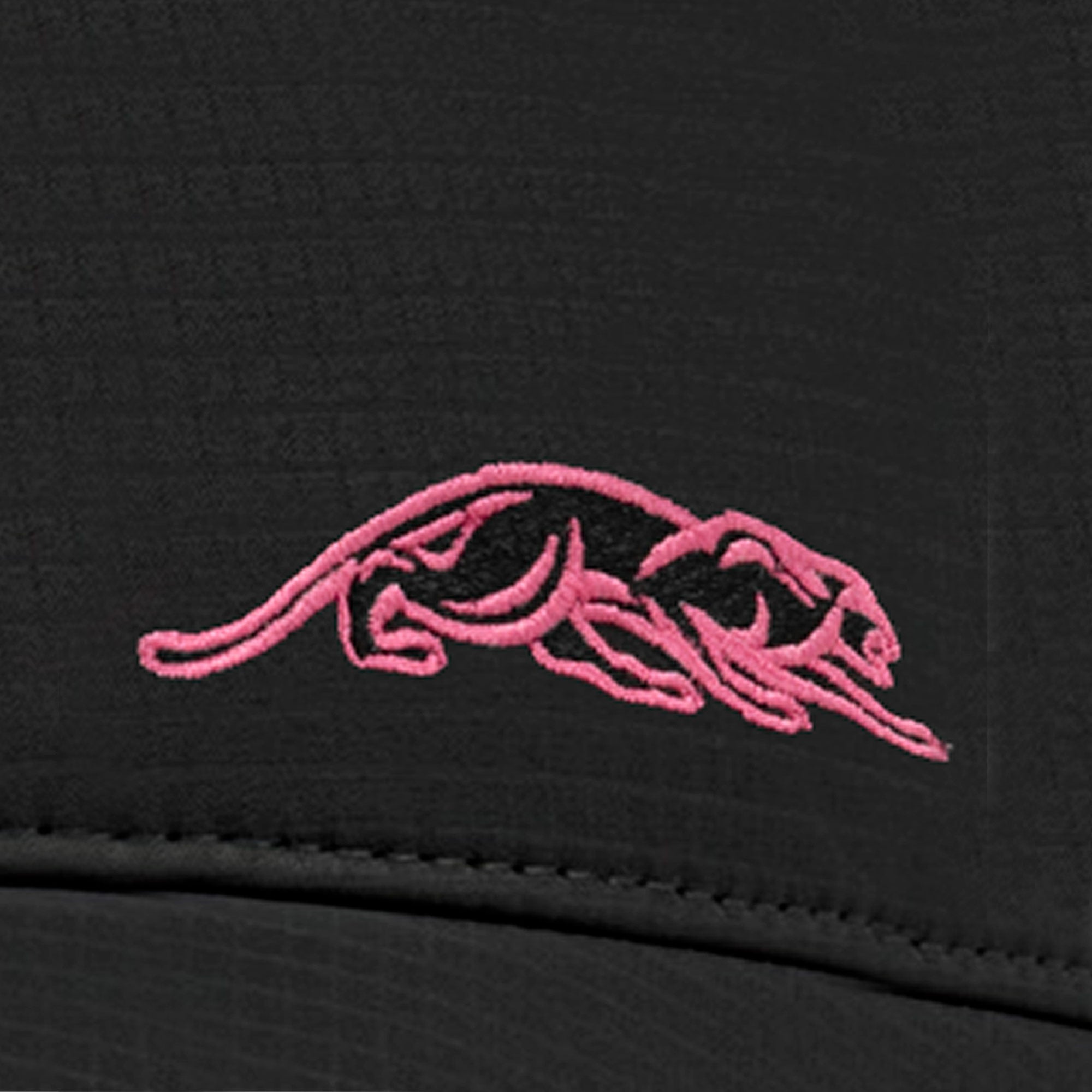 Pink embroidered panther logo against a black background.