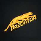 Gold embroidered Predator logo against a black background.