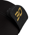 Close-up of black glove fabric with black glove lock featuring gold 30 logo