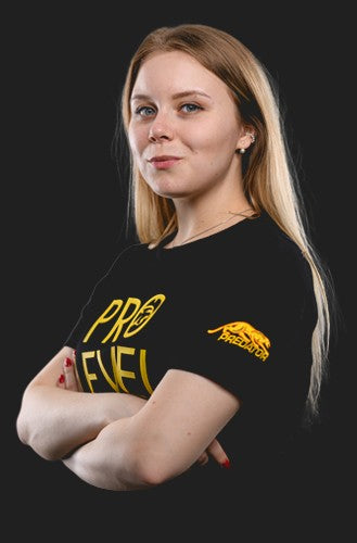 Woman wearing a black t-shirt with yellow text and logo