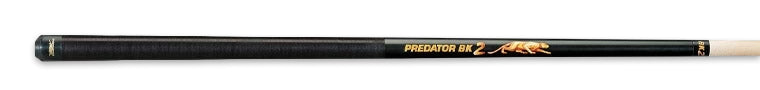 Black pool cue with gold accents and 'Predator' branding